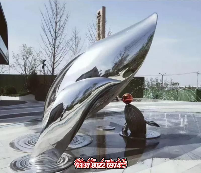 喷泉几只大小不一的不锈钢海豚雕塑