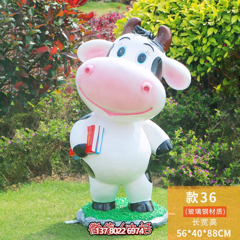 图书馆一只拿书的玻璃钢牛雕塑